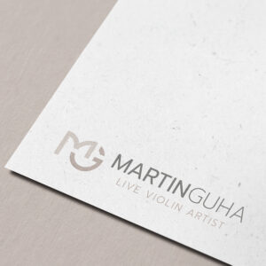 Martin Guha Logo – Design des Logos von Martin Guha mit charakteristischen Farben und Symbolen
